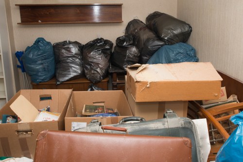 Eco-friendly furniture disposal with recycling bins in Bethnal Green